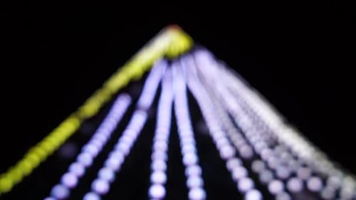 Abstract Festive Yelloworange Lights with Bokeh Sparkling Circular Stars Motion Holiday Concept