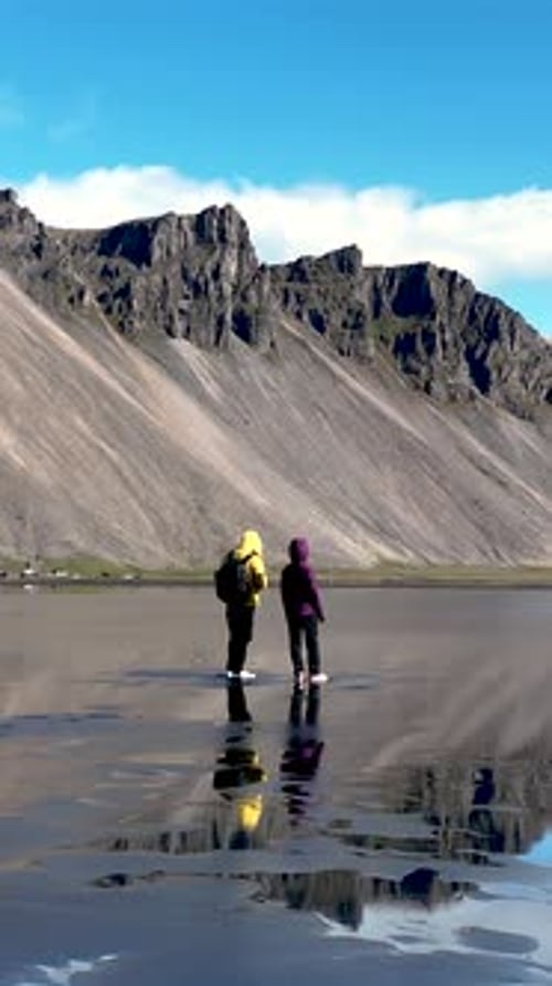 Standing in Awe at Stokksnes Vestrahorn Iceland Majestic Landscape