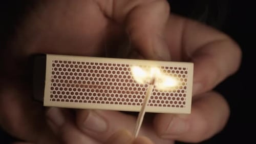 Striking a Match to Create Fire in Darkness