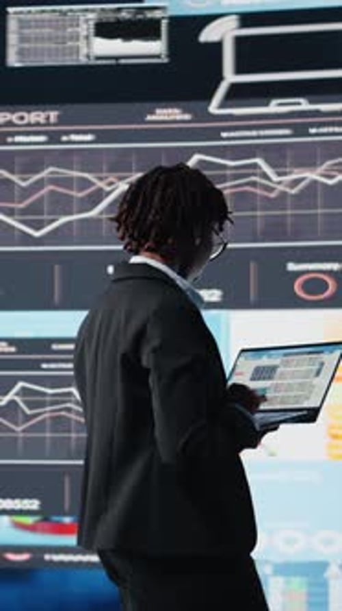 Vertical Video Manager Using Laptop Software to Compare Company Metrics