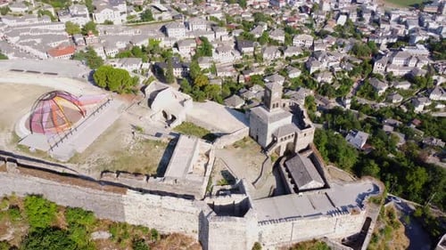 Aerial drone view of the old castle and fortress of the city of Gjirokaster or gjirokastra, Albania.