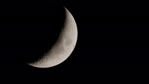 Detailed Close-Up of Crescent Moon in Black Sky