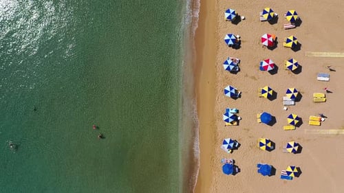 Concept of summer vacation. View from above, stunning aerial view of an amazing beach with beach umb