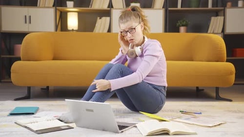 Admiring college student watching laptop