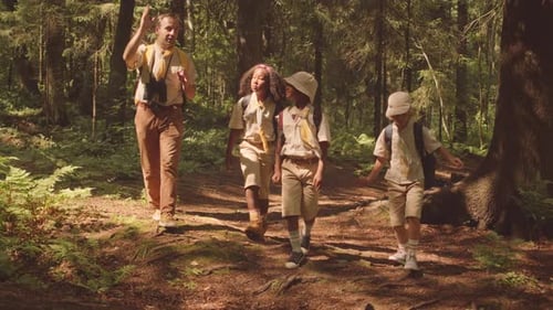 Scout Troop Hiking in Forest