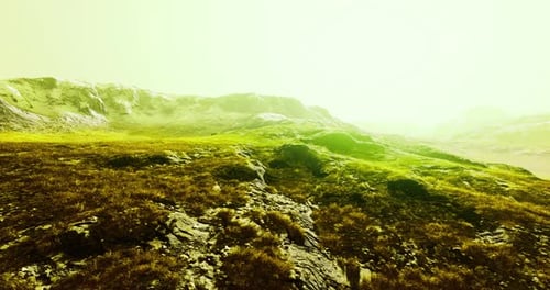 Surreal Green Yellow Mountain Landscape Aerial Flyover