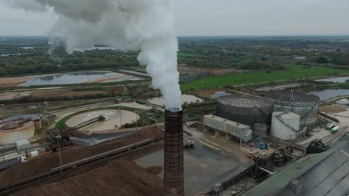 Aerial view of a factory with smoke stack, United Kingdom.