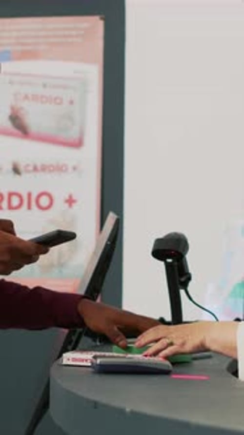 Vertical Video African American Client Using Mobile Nfc Payment on Pos to Pay for Vitamins