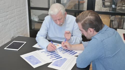 Business People Doing Paperwork in Office