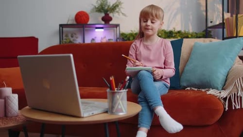 Girl Studying with Laptop at Home