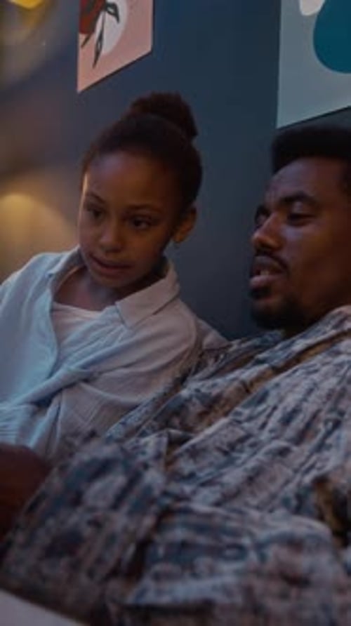 Father and Daughter Sharing a Cozy Evening at Home