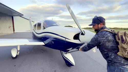 private pilot pushes piper cherokee 180 into hangar