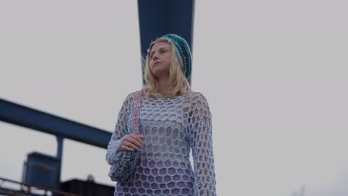 Stylish Woman with Knitted Beanie Posing