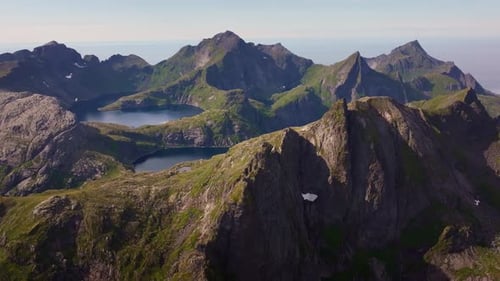 The Splendor of the Lofoten Islands' Dramatic Mountains and Fjords is Depicted in an Aerial View