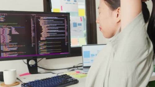 Asia girl development programmer overwork relax stretch muscle painful from office syndrome.