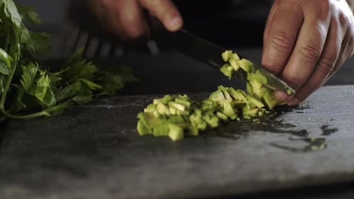 Adult Dicing Fresh Avocado with Sharp Knife