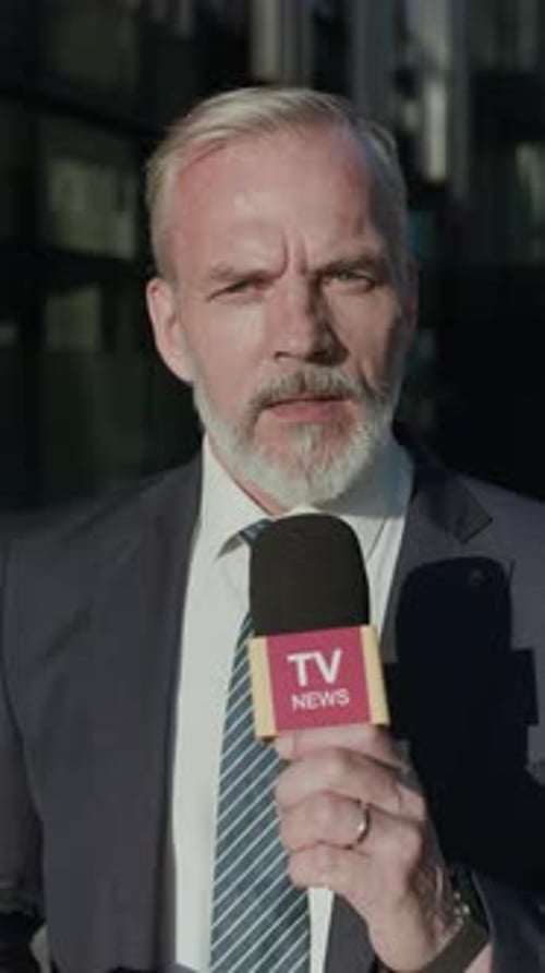 Professional Reporter Speaking With Authority Into Microphone