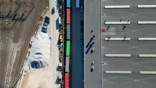 Aerial view of shipping containers, semi trucks cargo distribution of containers. Shipment from Chin