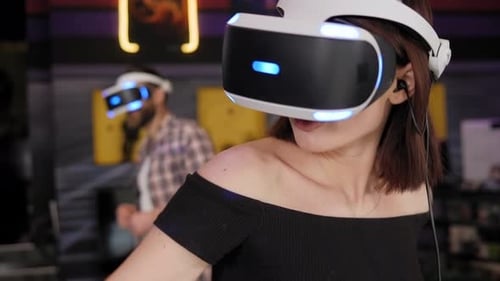 People Playing Virtual Reality Games with Headsets