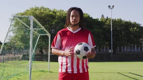 Video of african american football male player with ball