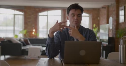 Man Talks During a Video Call at Home