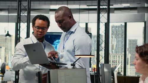 Engineers in Office Doing Software Development to Launch New Features
