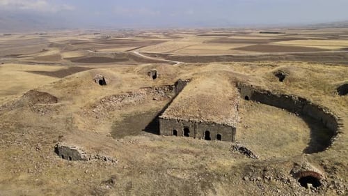 Ancient Building on Hilltop with Grassy Surroundings