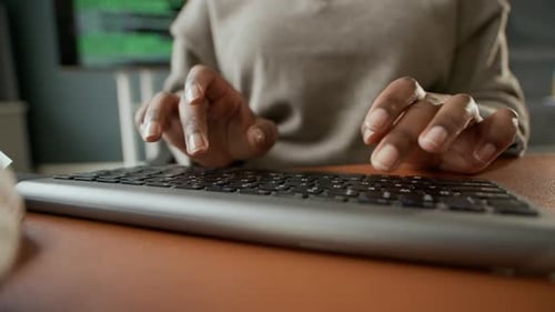 Hands of Office Employee Typing on PC Keyboard