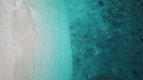 Serenity island exotic paradise destination aerial view descending over top of tourist boat on turqu