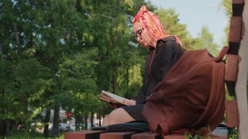 Park Bench with Thoughtful Traveler Person Resting with Book in City Park Calm City Environment with
