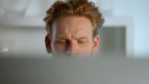 Freelancer Working Desktop Computer At Office Closeup. Focused Ginger Manager Contemplating Analy...
