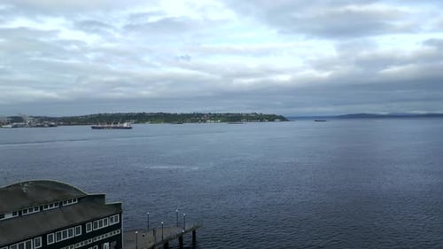 Picturesque Aerial View of Calm Ocean Bay and Cloudscape Along Seattle Waterfront