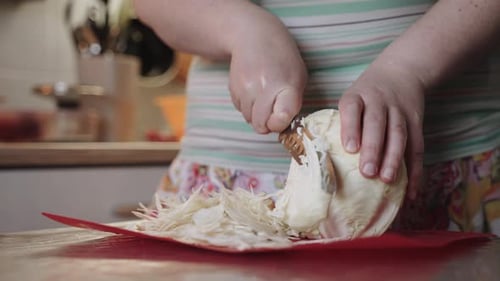 Caucasian Woman Hands Slicing White Cabbage on Kitchen Counter Close Up