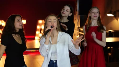 Women Singing Karaoke and Dancing at Night