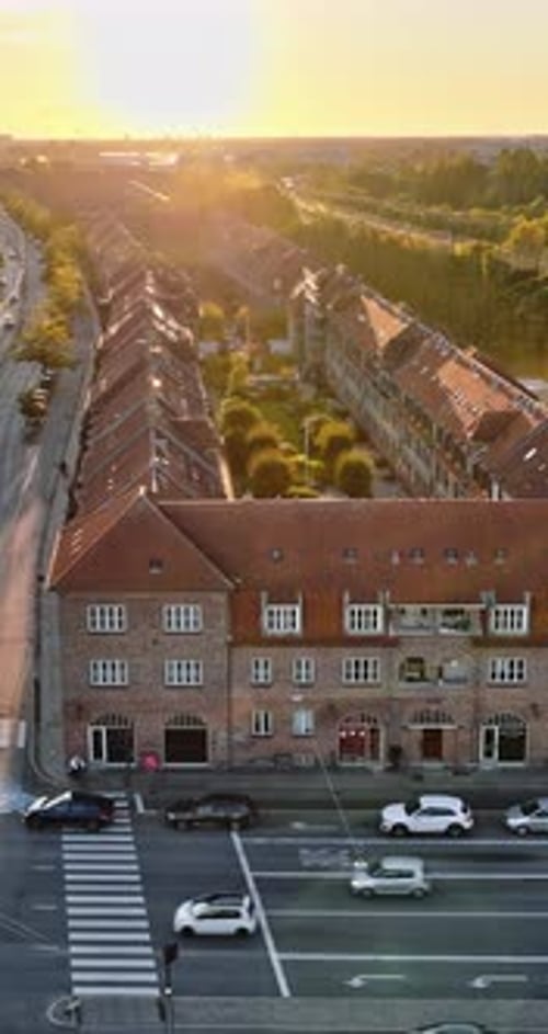 Aerial drone view of Vesterbro district in Copenhagen, Denmark at sunset. Vertical