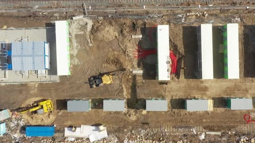 Aerial View of Construction Site with Excavator