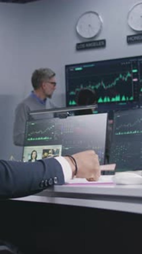 African American Trader Makes Notes and Works