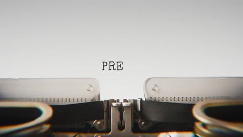 Old mechanical typewriter typing Prevention in a close-up view.