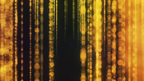 Glamour Collection: Out of focus yellow colored strings passing across a black background