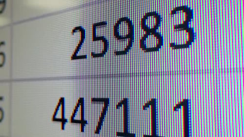 Closeup of Financial Cash Flow Data on PC Screen Mortgage Payment Sheet Schedule Loan Fee