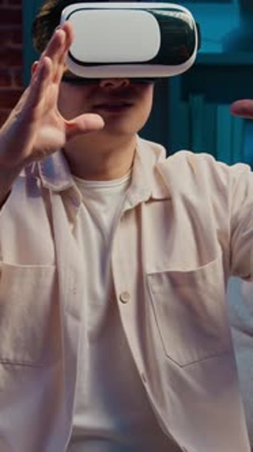 Man Immersed in Virtual Reality Experience at Home