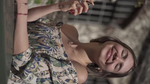 Woman Sprays Perfume Outside