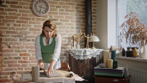 Woman Crafts DIY Project in Rustic Home