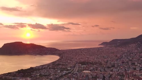 Aerial View Pink Hues Over Turkish Urban Landscape at Sunset