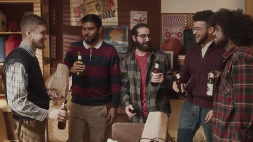 Geeks Drinking Beer and Chatting at Garage Programming Office