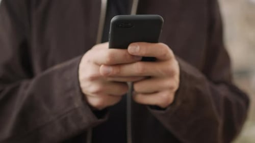 Man Using Mobile Phone Device Outdoors