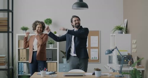 Loop of Businesspeople Biracial Team Dancing and Looking at Camera Fooling Around in Office Room