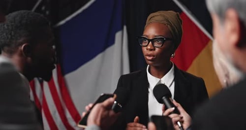 Woman, press and mic for interview with talking, media questions for state official