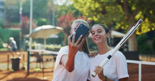 Smiling Women Taking Selfie at Tennis Court
