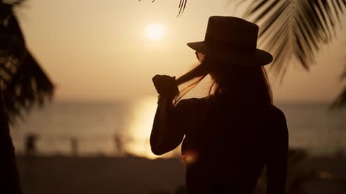 Woman Relaxes on Tropical Island Beach Pretty Woman in Bikini Admire View Under Palm Tree on Sand